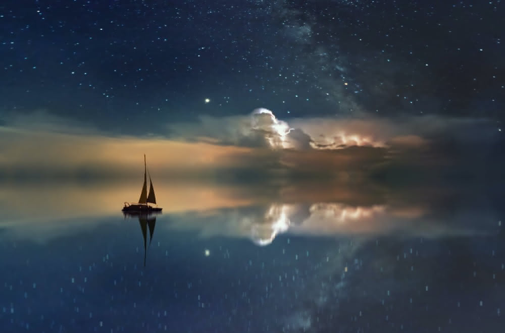 ship on water reflecting sky